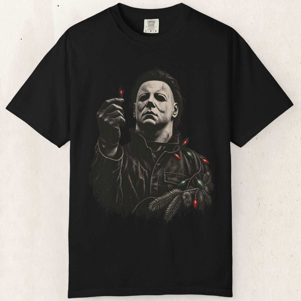 Wicked Thread Society black heavyweight cotton t-shirt featuring a graphic of Michael Myers holding a Christmas light.
