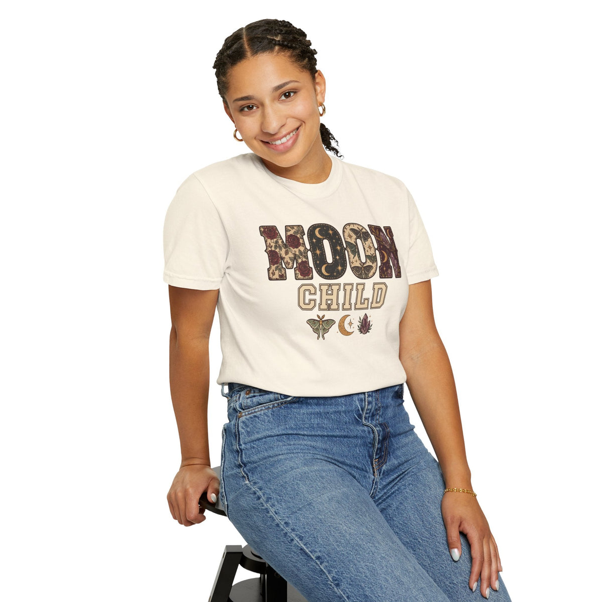 Wicked Thread Society cream graphic tee with Moon Child text, celestial, and floral motifs worn by a smiling woman.