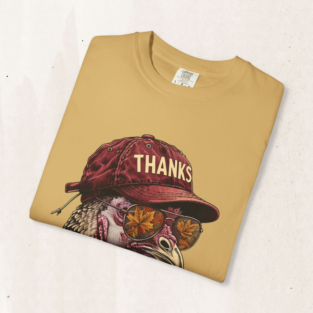 Wicked Thread Society mustard yellow Thanksgiving t-shirt featuring a turkey wearing a baseball cap and sunglasses.