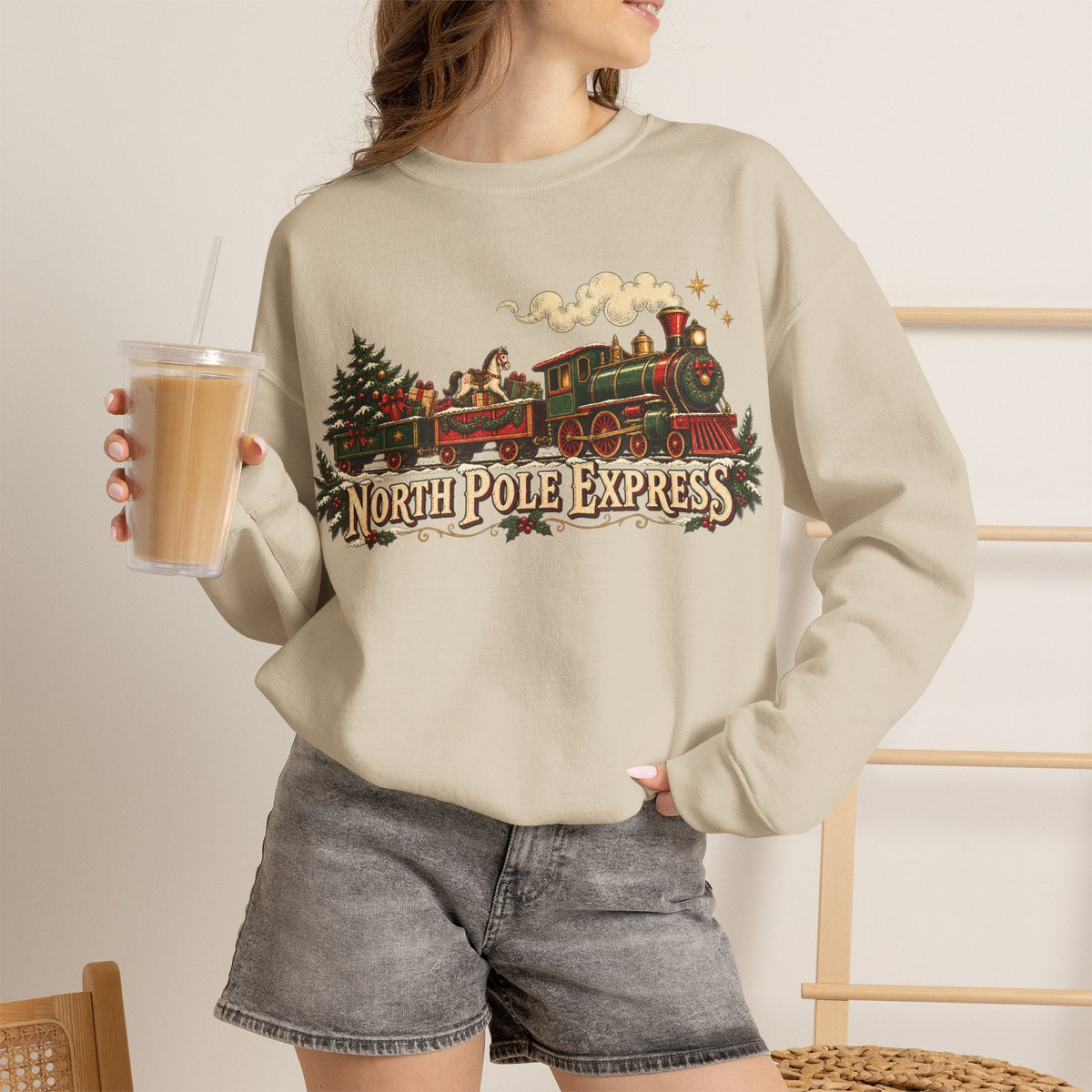 Wicked Thread Society beige crewneck sweatshirt featuring a vintage North Pole Express steam train holiday graphic.