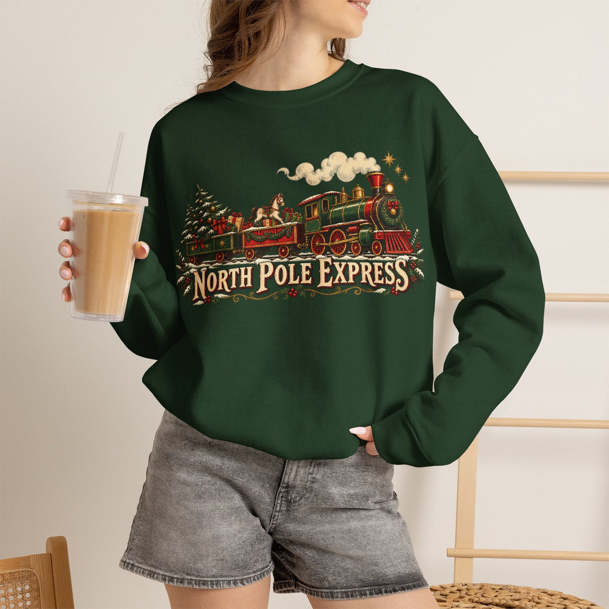 Wicked Thread Society dark green crewneck sweatshirt featuring a vintage North Pole Express steam train holiday graphic
