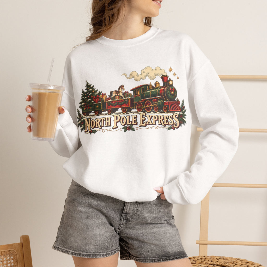 Wicked Thread Society white crewneck sweatshirt featuring a vintage North Pole Express steam train Christmas graphic.
