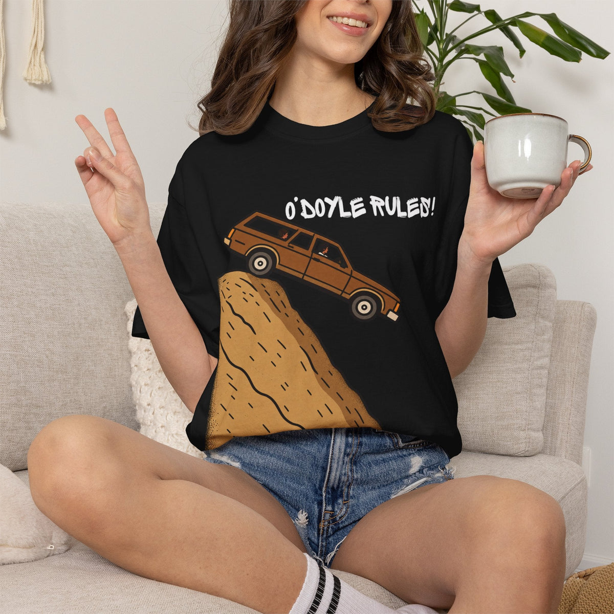 Wicked Thread Society black graphic tee featuring a wood-paneled wagon on a hill with O'Doyle Rules! text on a model