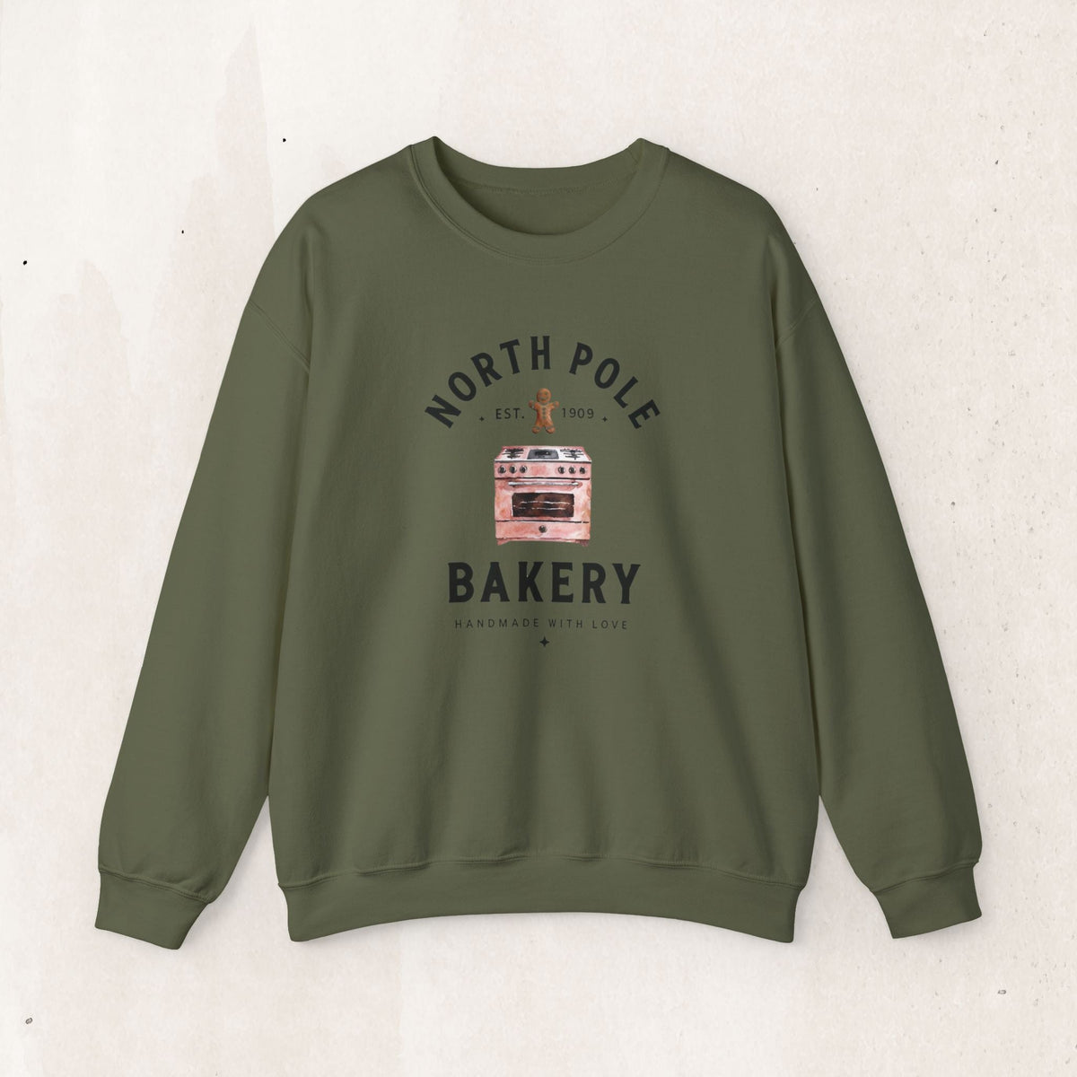 Wicked Thread Society olive green crewneck sweatshirt featuring a vintage North Pole Bakery oven and gingerbread man