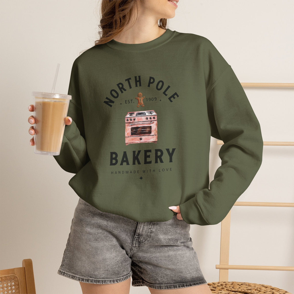 Wicked Thread Society olive green crewneck sweatshirt with North Pole Bakery oven and gingerbread man graphic
