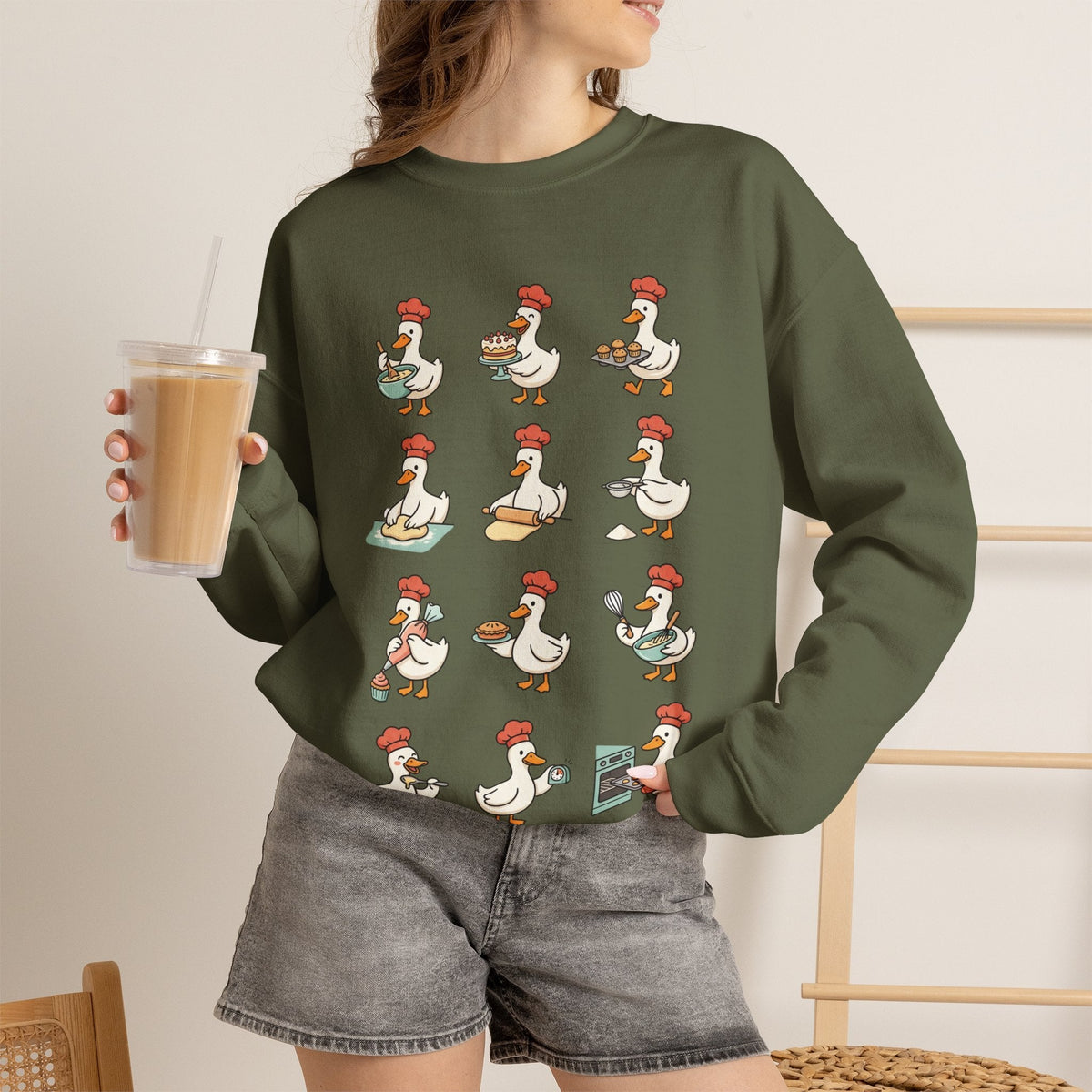 Wicked Thread Society olive green crewneck sweatshirt featuring a whimsical print of geese baking for Thanksgiving.