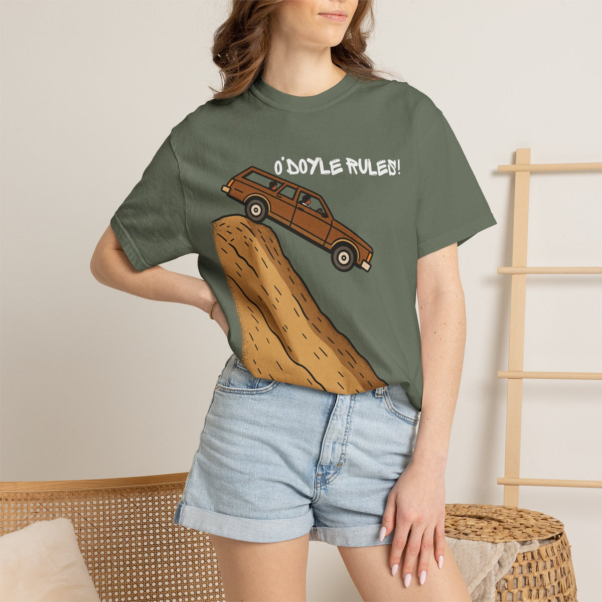 Wicked Thread Society relaxed-fit olive green cotton graphic tee featuring a wood-paneled wagon on a sandy hill.