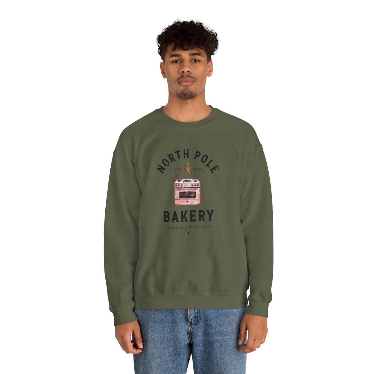 Wicked Thread Society olive green crewneck sweatshirt with North Pole Bakery gingerbread oven graphic on a man
