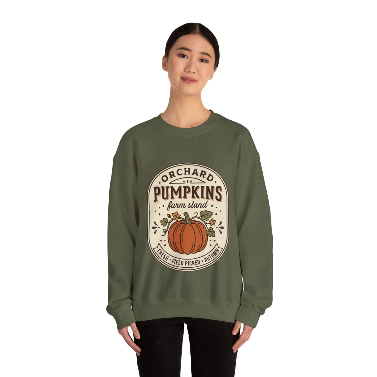 Wicked Thread Society olive green crewneck sweatshirt with a vintage pumpkin farmstand graphic print on a model