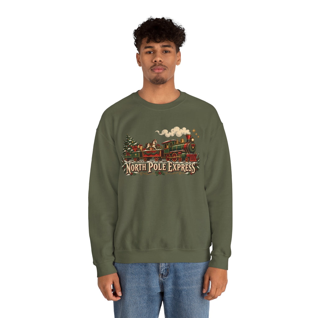 A man wearing a Wicked Thread Society olive green crewneck sweatshirt with a vintage North Pole Express train graphic.
