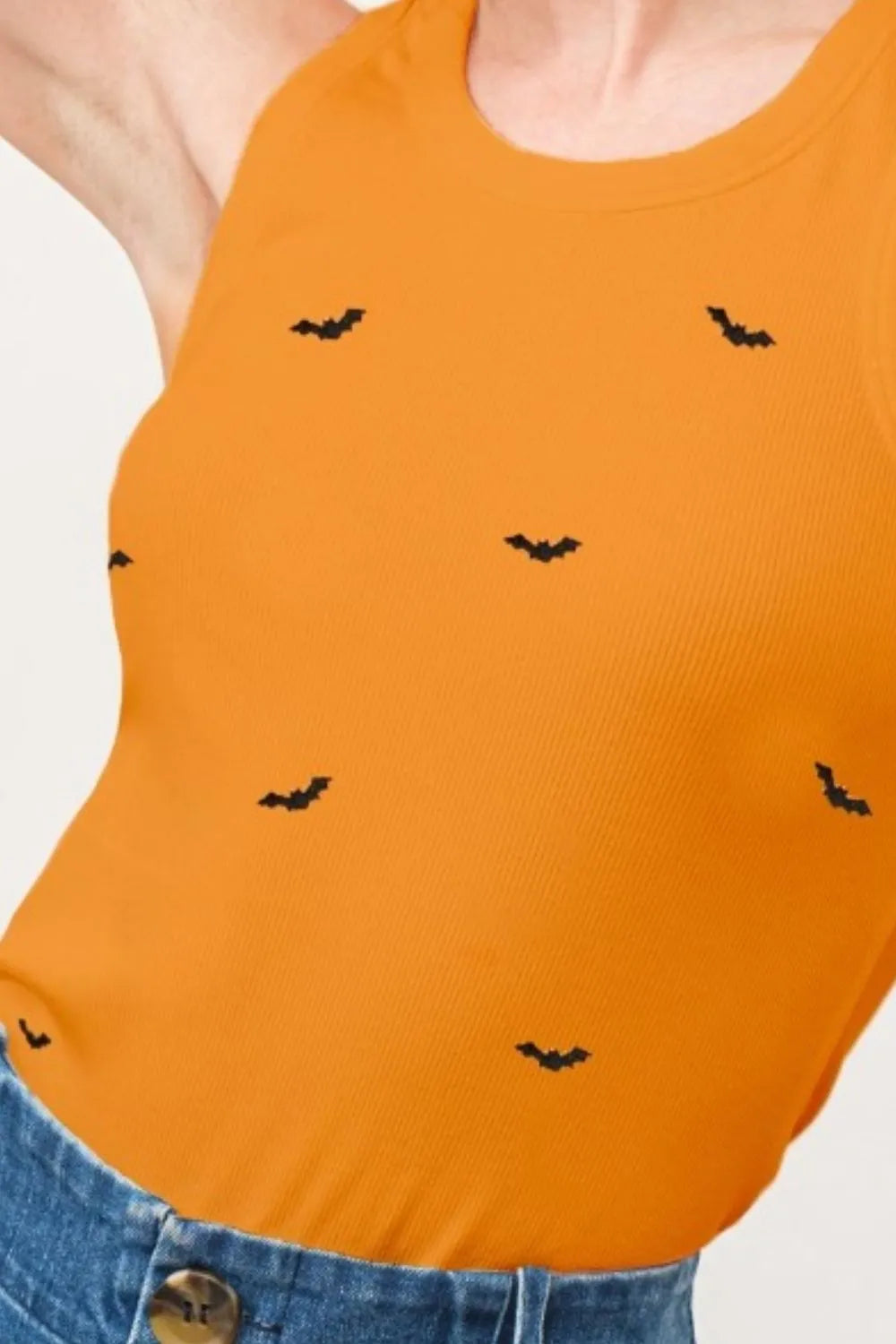 Wicked Thread Society orange ribbed tank top featuring small black bat embroidery for a spooky Halloween style.