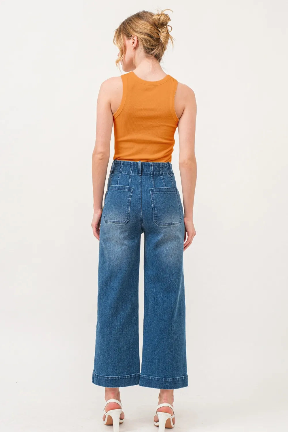 Wicked Thread Society orange ribbed tank top worn with wide-leg blue jeans, back view on a model