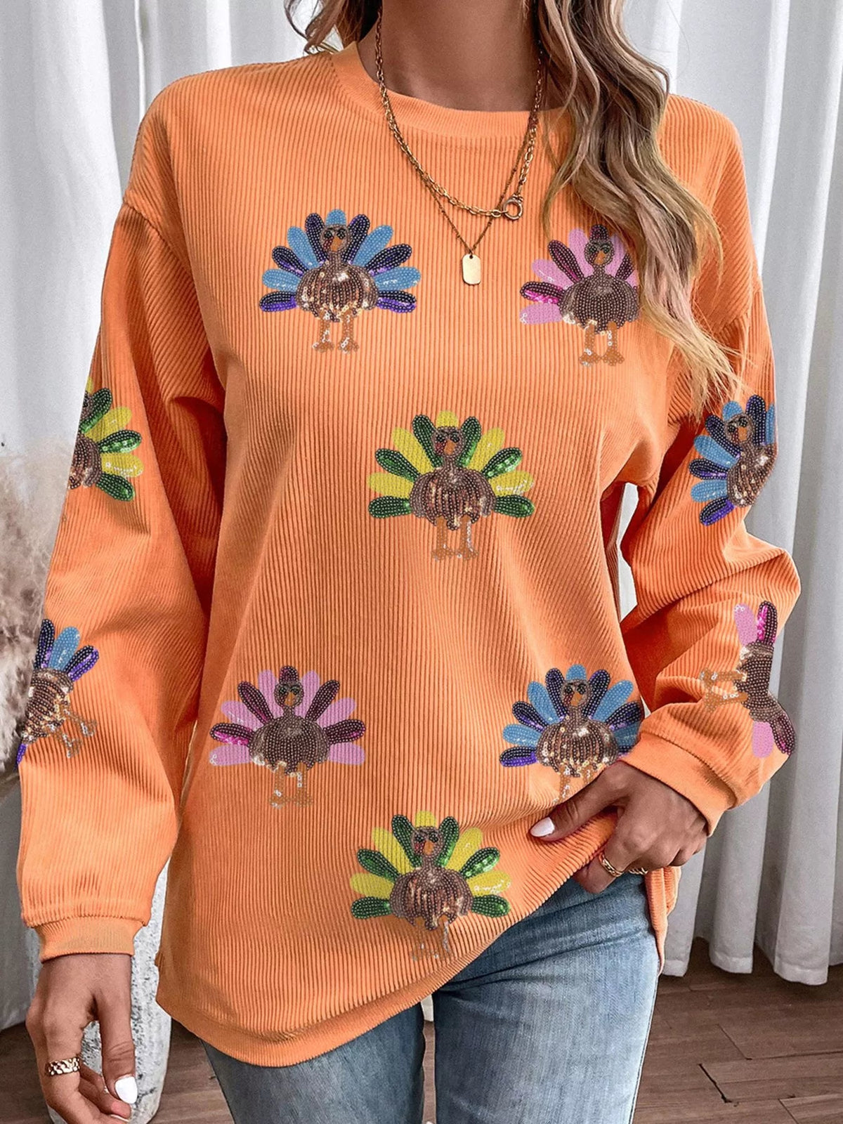 Wicked Thread Society orange corded crewneck sweater featuring a playful turkey graphic with colorful sequins