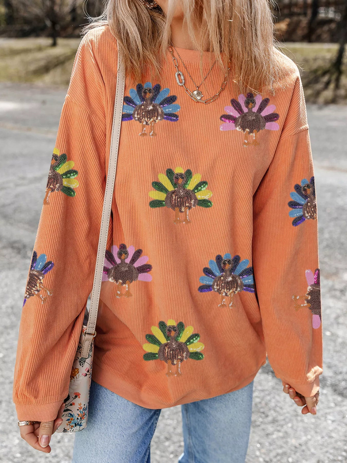 Wicked Thread Society orange corded crewneck sweatshirt featuring a playful turkey graphic with colorful sequins