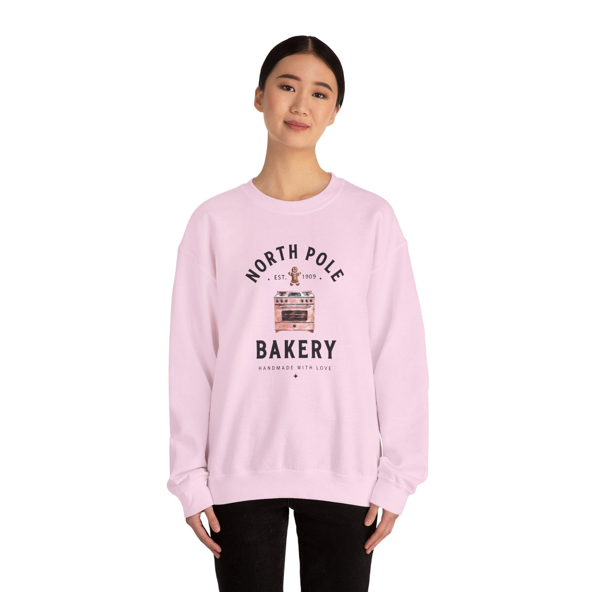 Wicked Thread Society light pink crewneck sweatshirt featuring a vintage North Pole Bakery oven and gingerbread man.