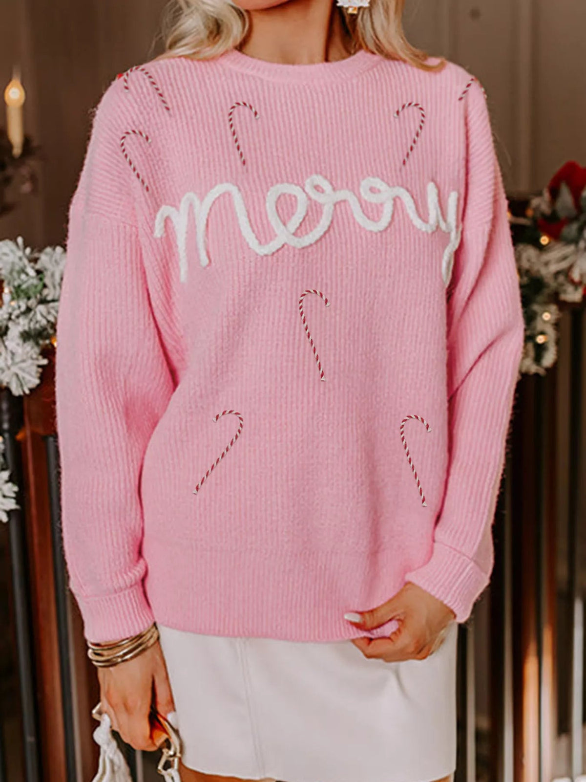 Wicked Thread Society pink knit sweater with white embroidered merry text and small candy cane accents