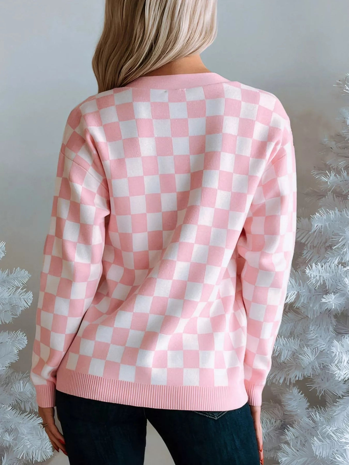 Wicked Thread Society pink and white checkered cardigan with ribbed hem, worn by a blonde woman near white trees.