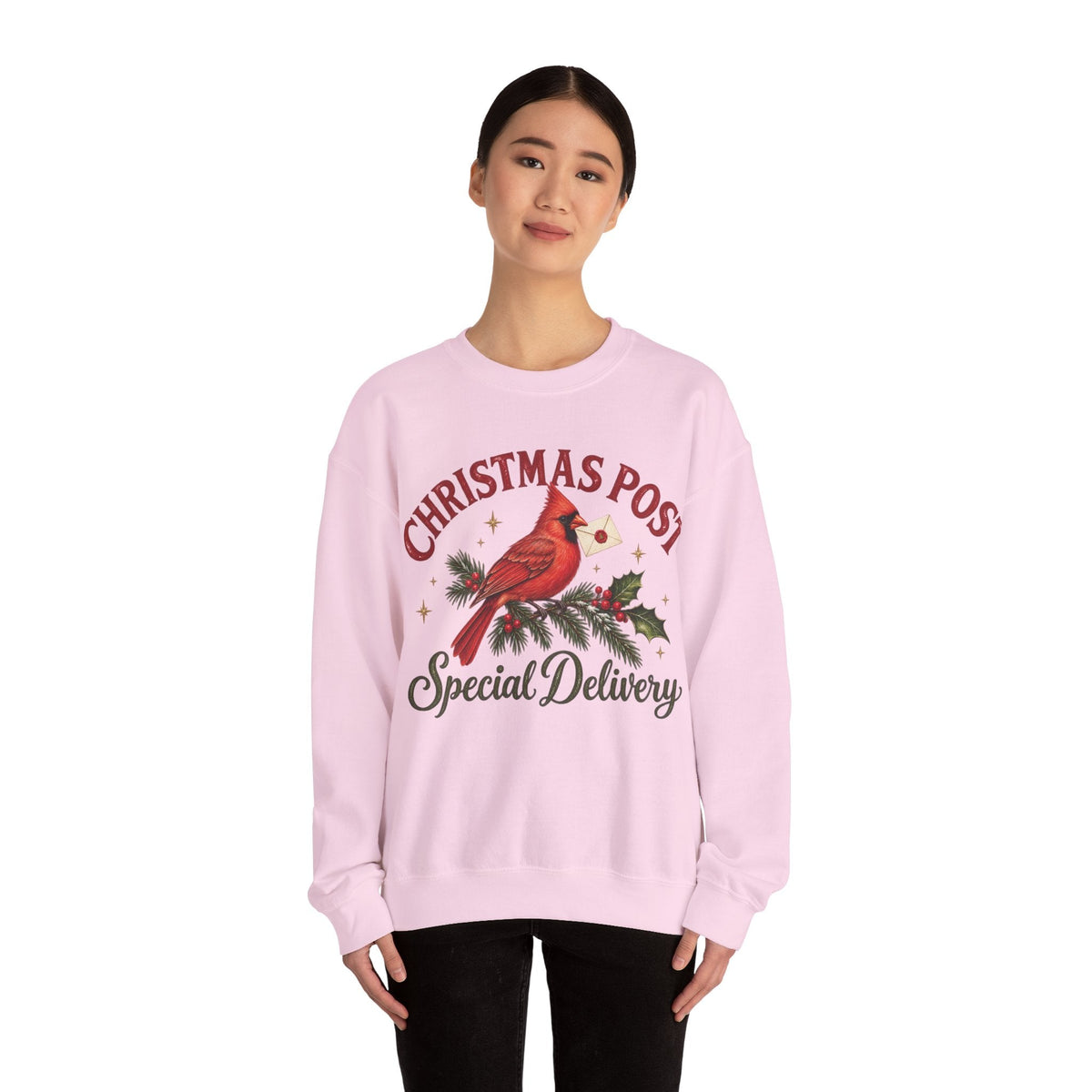 Wicked Thread Society light pink crewneck sweatshirt featuring a cardinal on a pine branch with Christmas Post text.