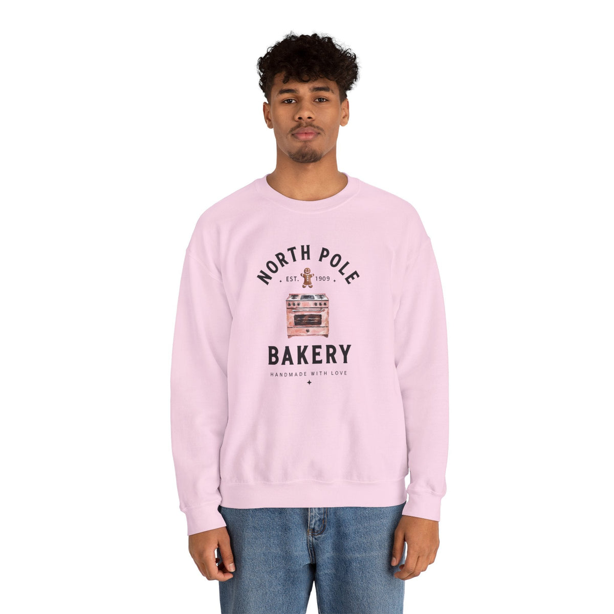 Wicked Thread Society light pink crewneck sweatshirt featuring a North Pole Bakery oven and gingerbread man graphic.