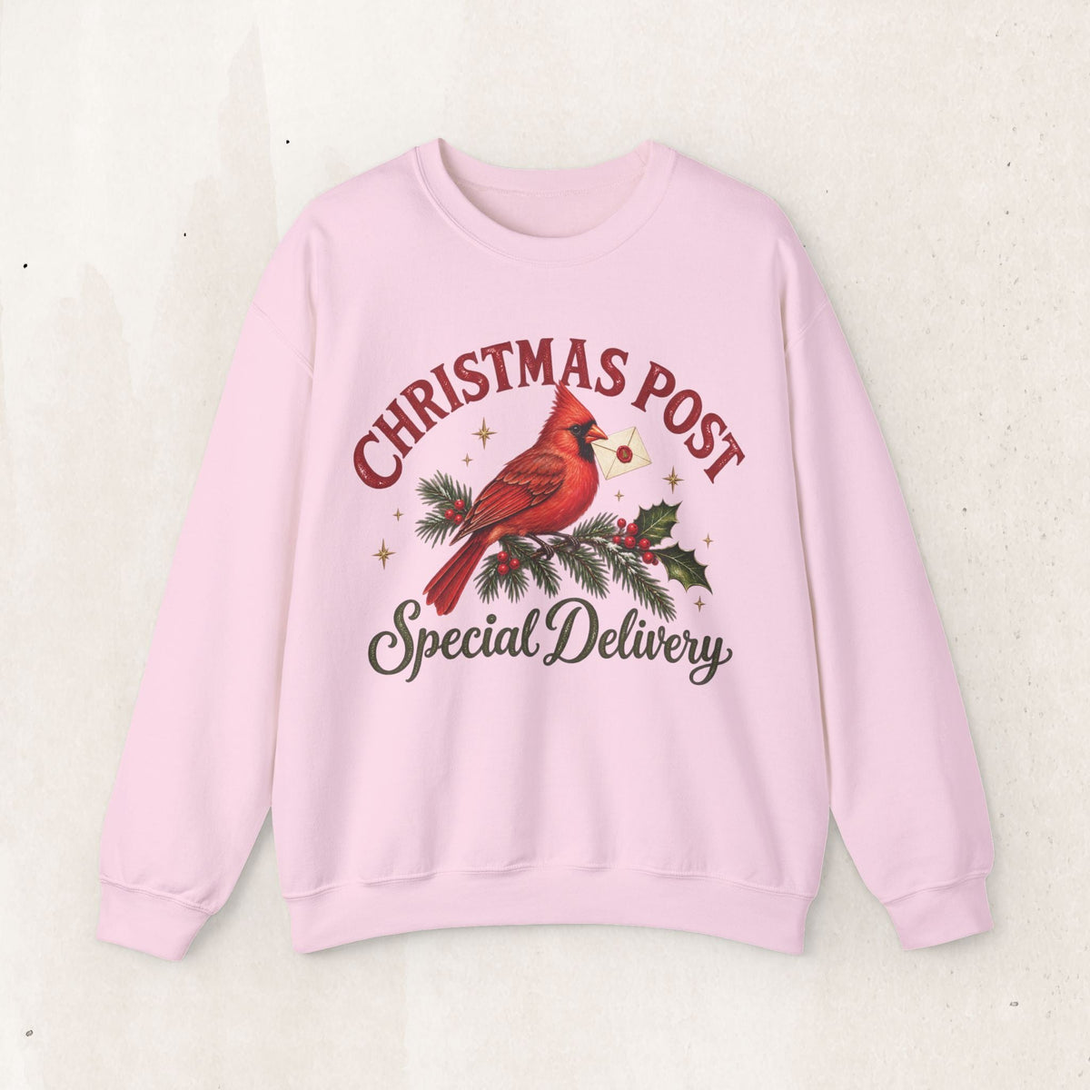Wicked Thread Society light pink crewneck sweatshirt featuring a cardinal on a pine branch with a holiday letter.