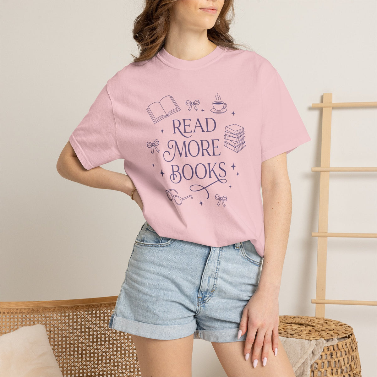 Wicked Thread Society pink cotton graphic tee featuring a Read More Books illustration with a book, cup, and bows.