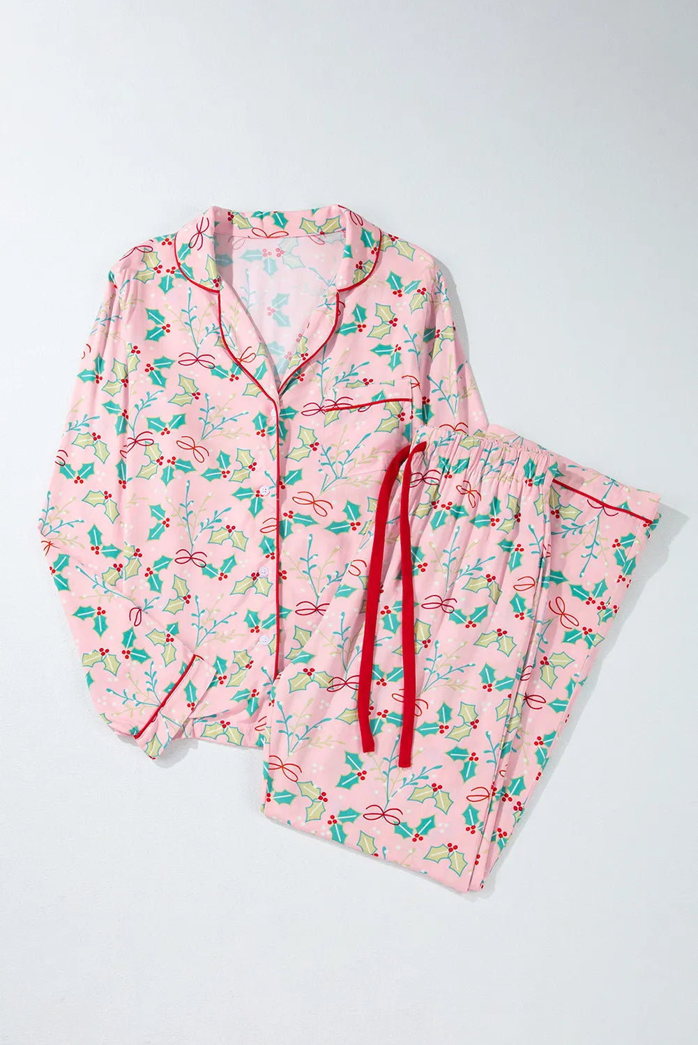 Wicked Thread Society pink viscose lounge set with holiday holly print, long sleeves, and red piping details.