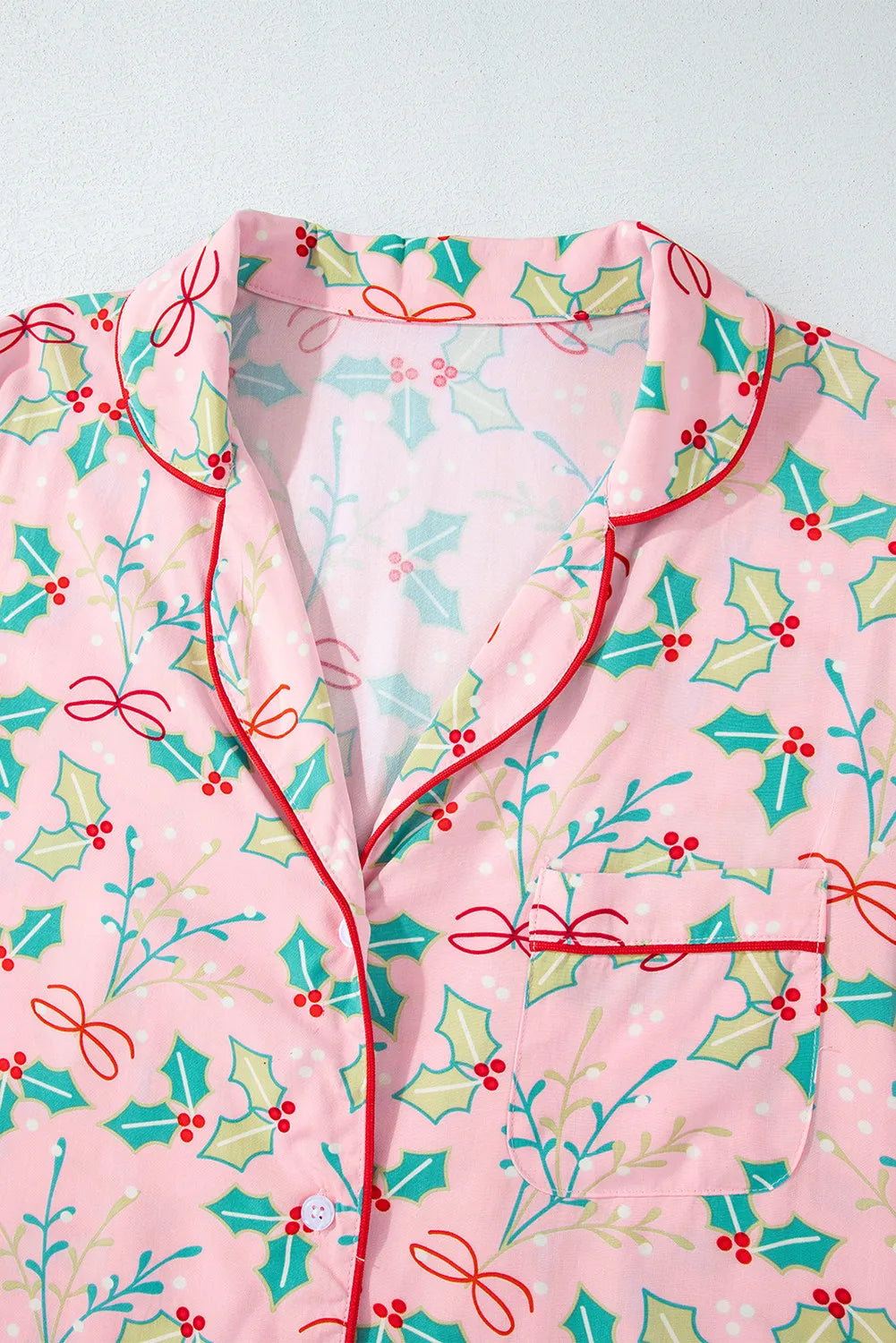 Wicked Thread Society pink viscose lounge set with festive holly and berry print, collared neck, and red piping trim