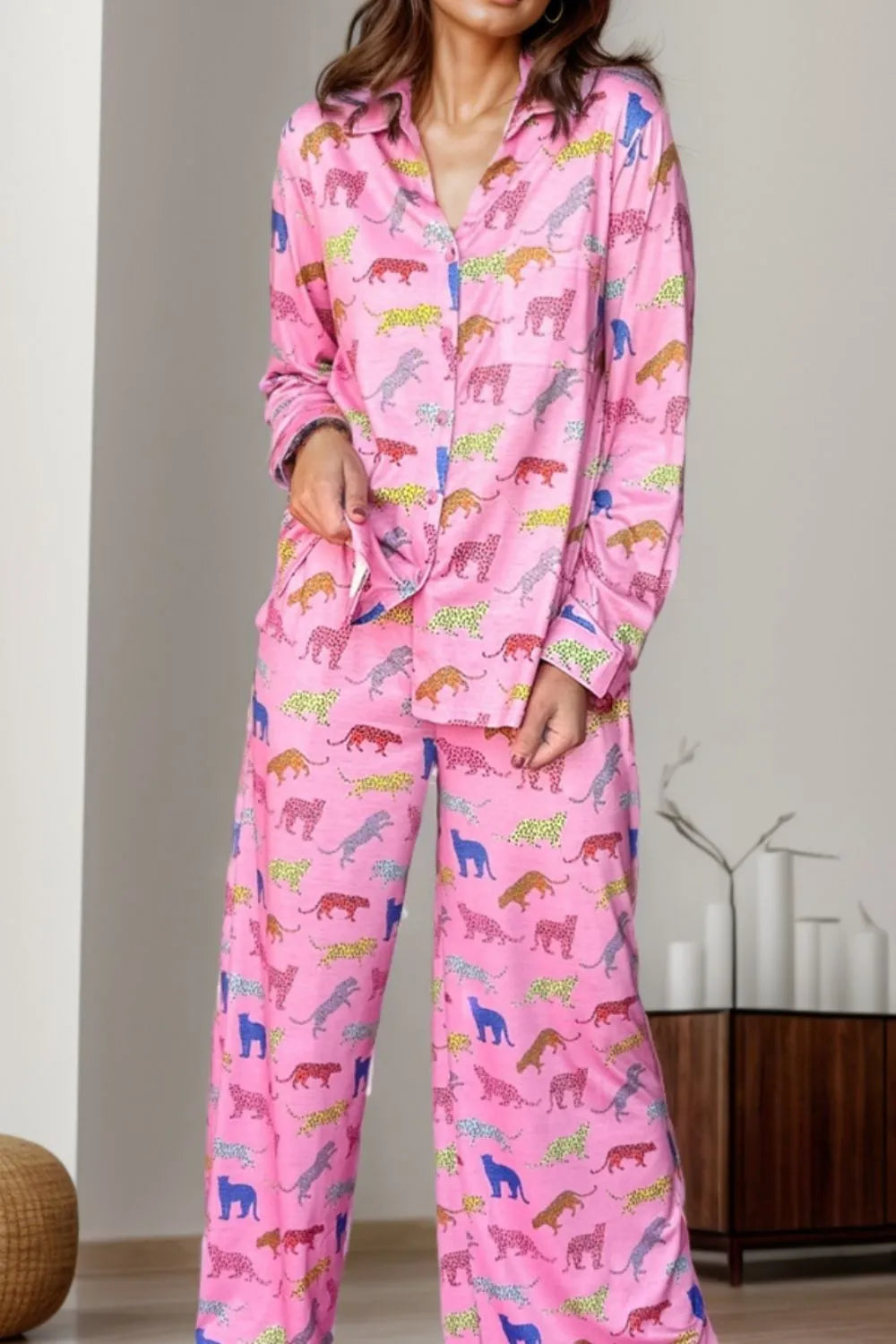 Wicked Thread Society pink two-piece lounge set with a colorful leopard print, featuring a button-down top and pants.