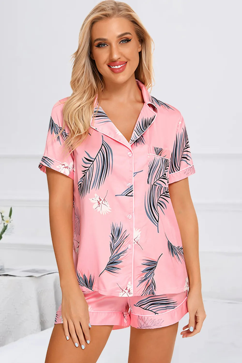 Wicked Thread Society pink lounge set featuring a button-up short sleeve top and matching shorts with leaf print.