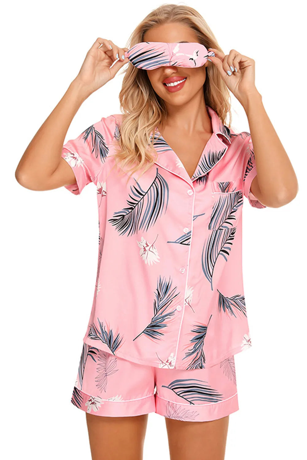 Wicked Thread Society pink lounge set with palm leaf print, button-up short sleeve top, shorts, and matching eye mask