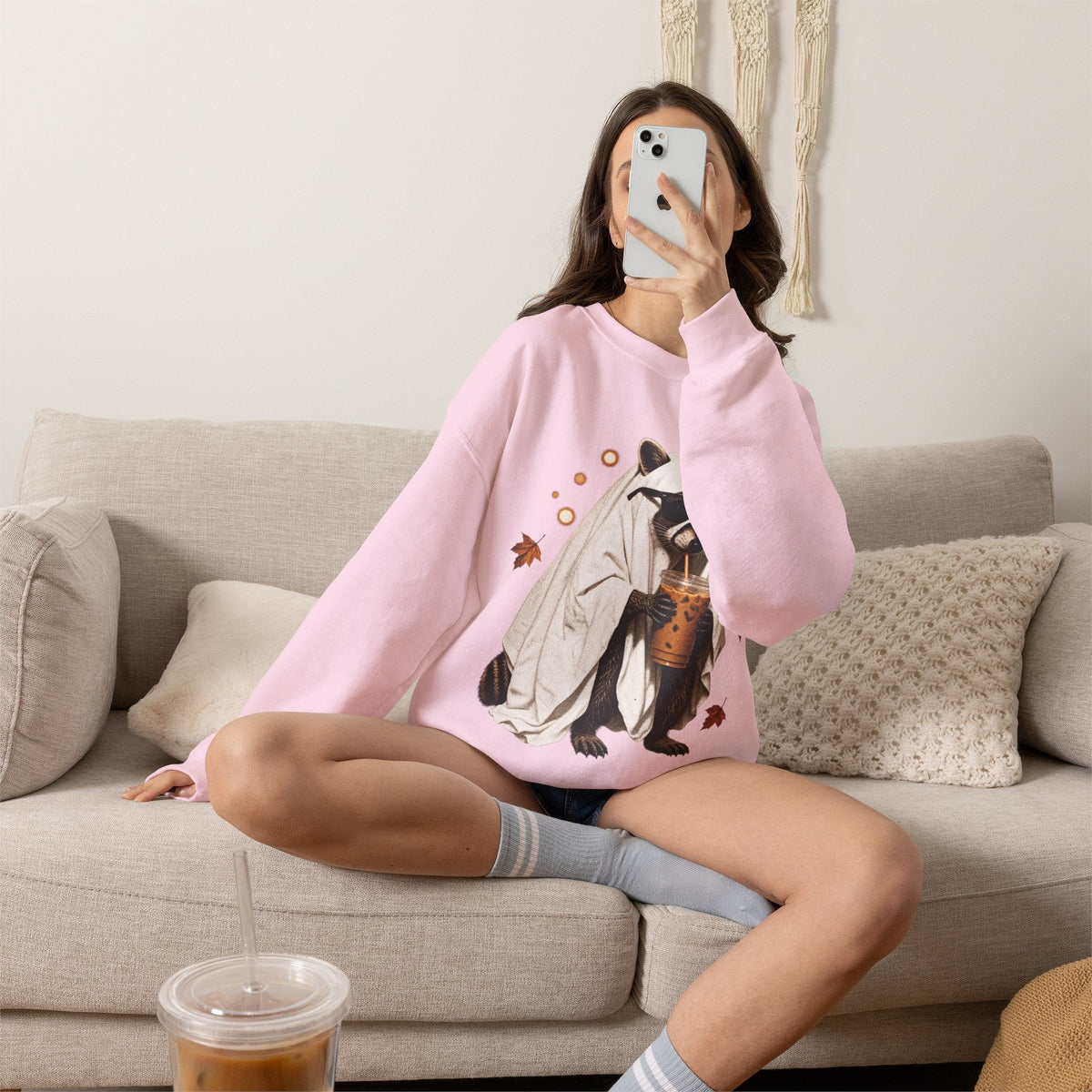 Wicked Thread Society light pink crewneck sweatshirt featuring a cute raccoon ghost graphic holding a boba tea cup.