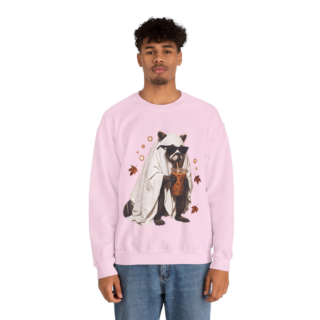 A man wearing a light pink Wicked Thread Society crewneck sweatshirt featuring a raccoon in a ghost costume with boba.