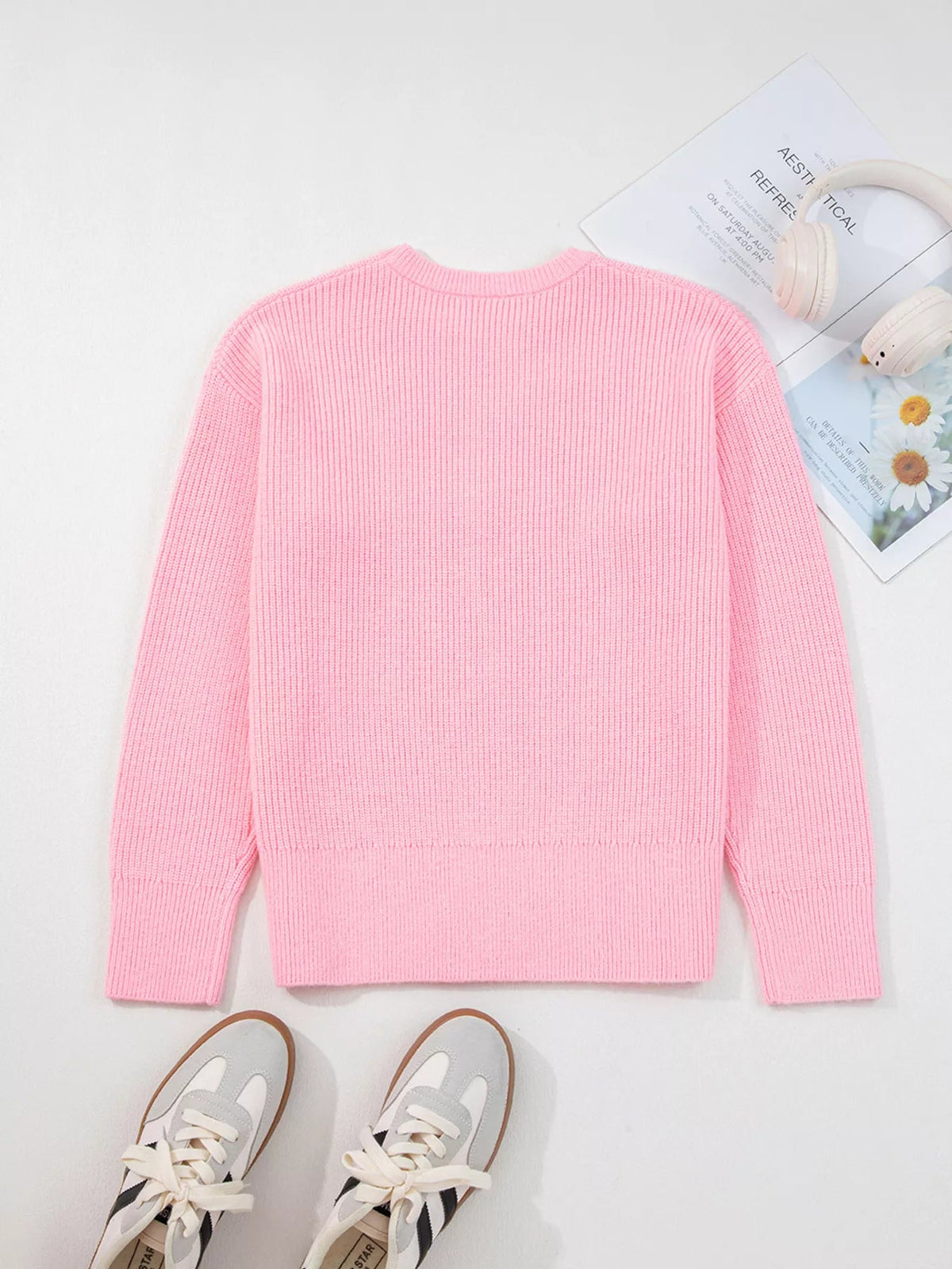 Back view of a Wicked Thread Society pink ribbed knit crew neck sweater on a white background with sneakers.