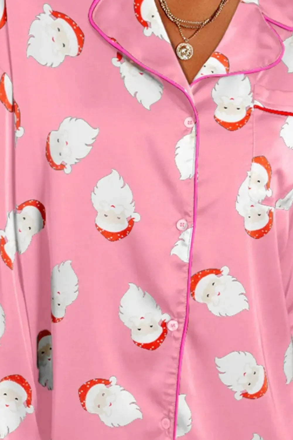 Wicked Thread Society pink long sleeve lounge top with a Santa Claus pattern, collared neck, and button-up front.