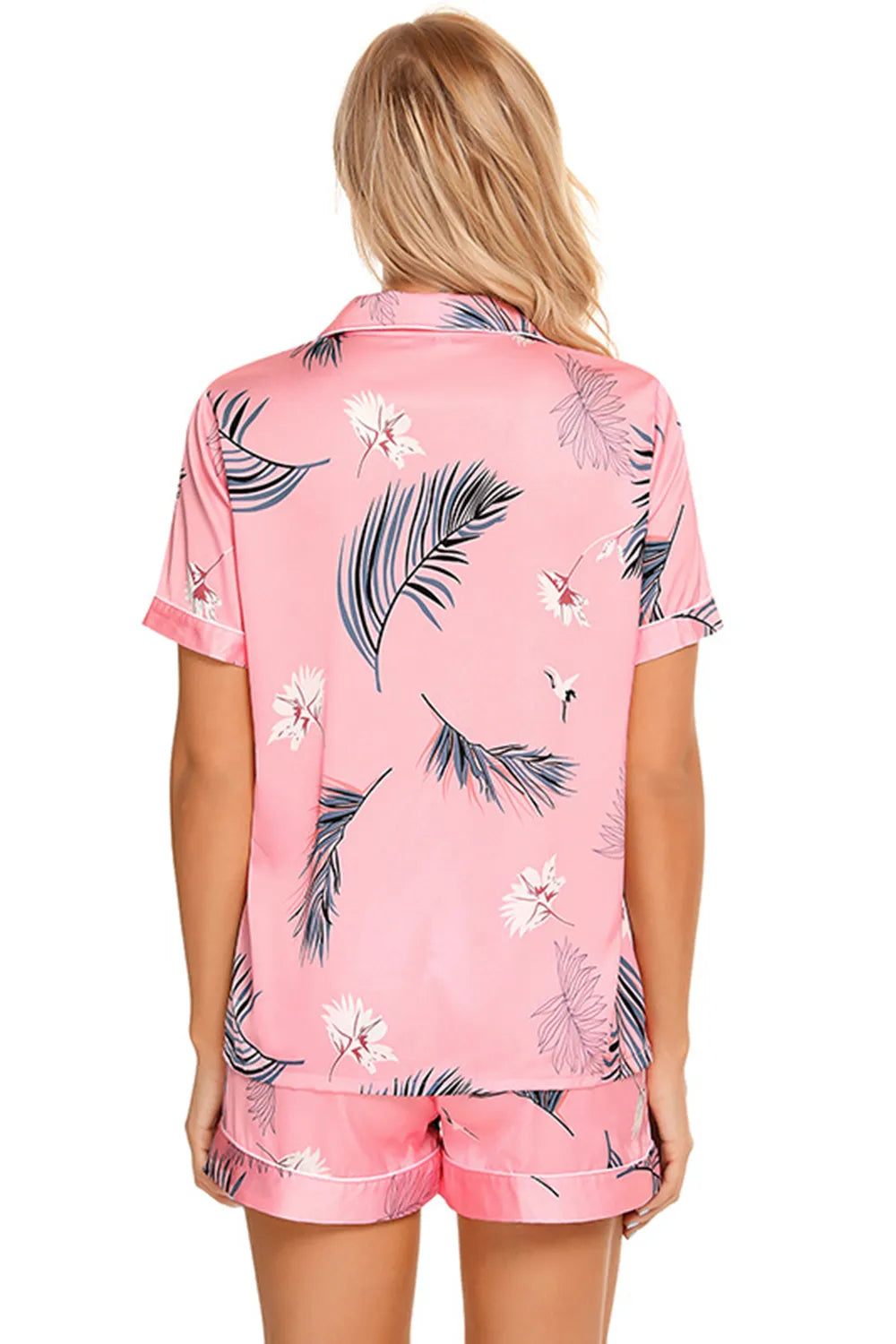 Back view of a Wicked Thread Society pink lounge set with a tropical leaf print, button-up top, and matching shorts.