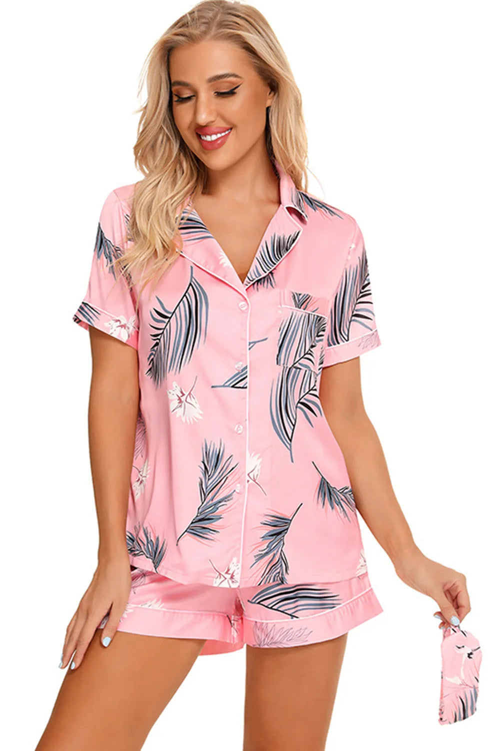 Wicked Thread Society pink lounge set with palm leaf print, featuring a button-up short sleeve top and matching shorts.