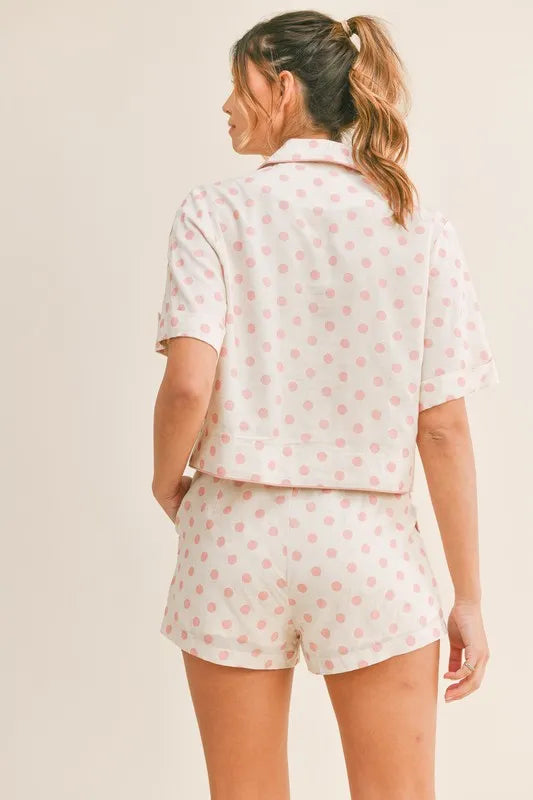 Back view of a model wearing a Wicked Thread Society polka dot crop top and matching shorts lounge set in cream/pink.