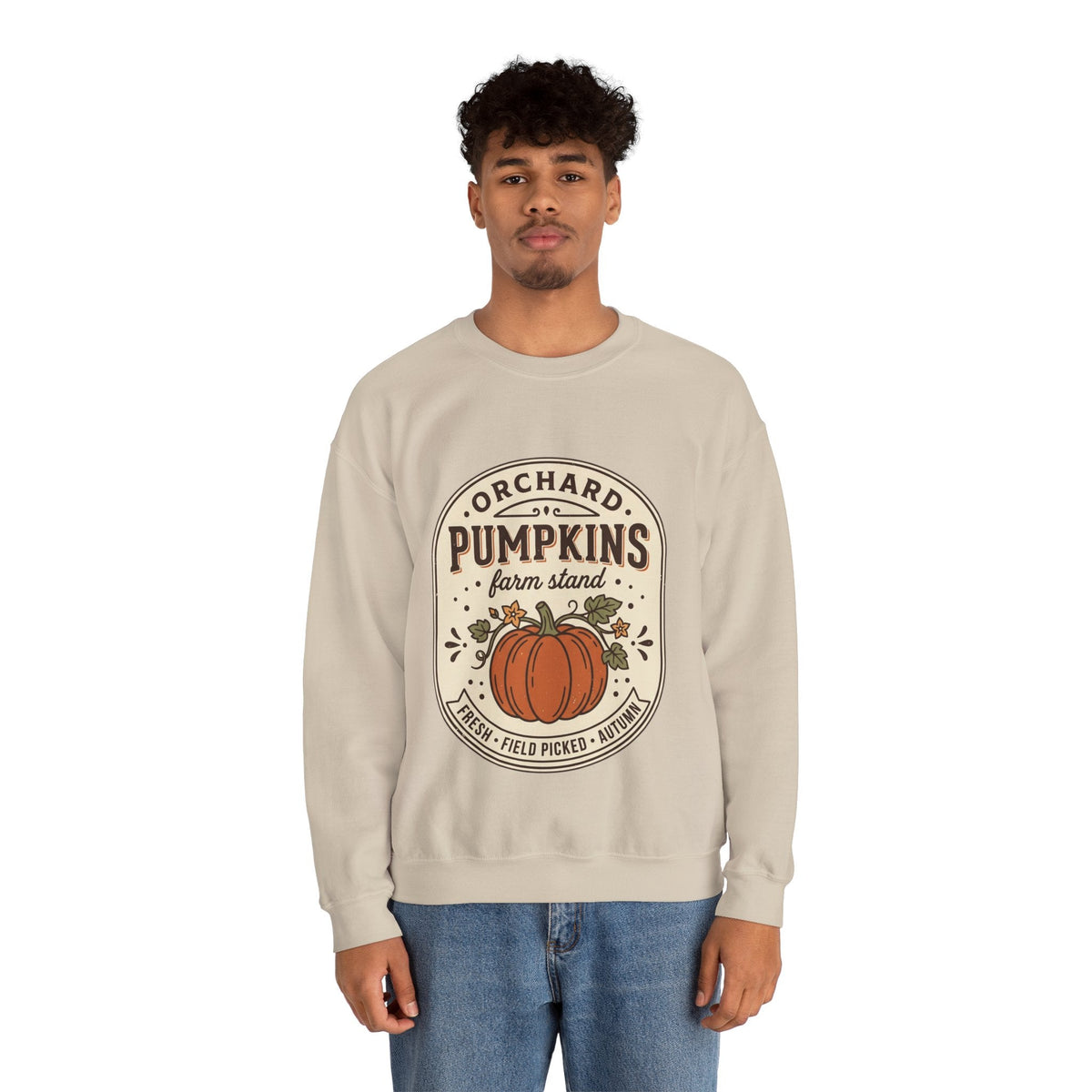 Wicked Thread Society beige crewneck sweatshirt with a vintage pumpkin farmstand graphic worn by a young man.
