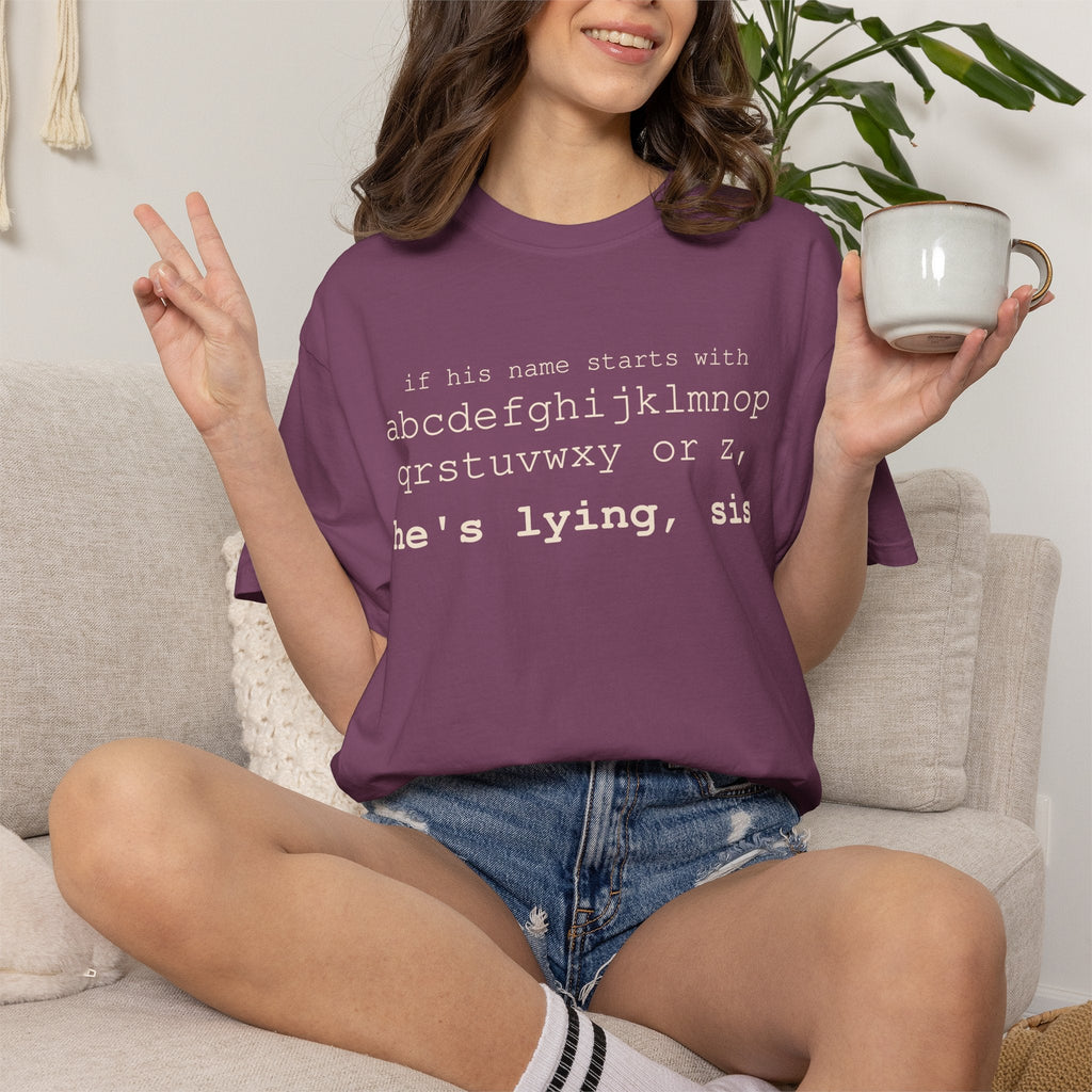 He's Lying, Sis T-shirt | Typographic alphabet humor tee Printify