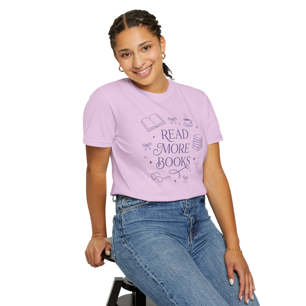 Wicked Thread Society light purple graphic tee with Read More Books illustration worn by a smiling woman in jeans.