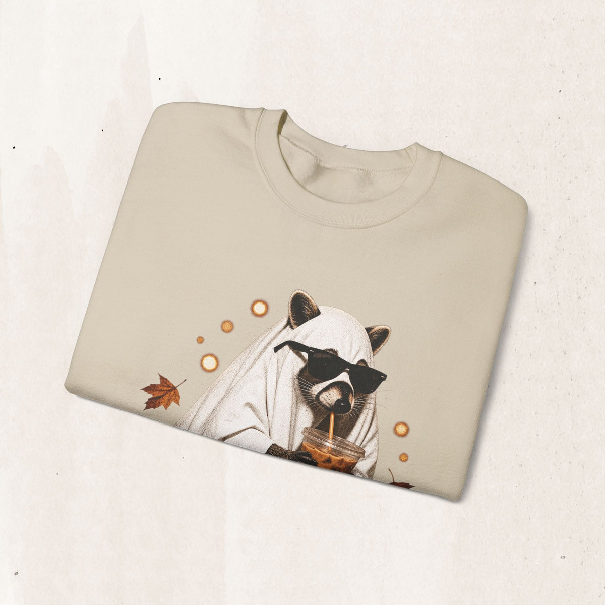 Wicked Thread Society beige crewneck sweatshirt featuring a graphic of a raccoon in a ghost costume drinking boba.