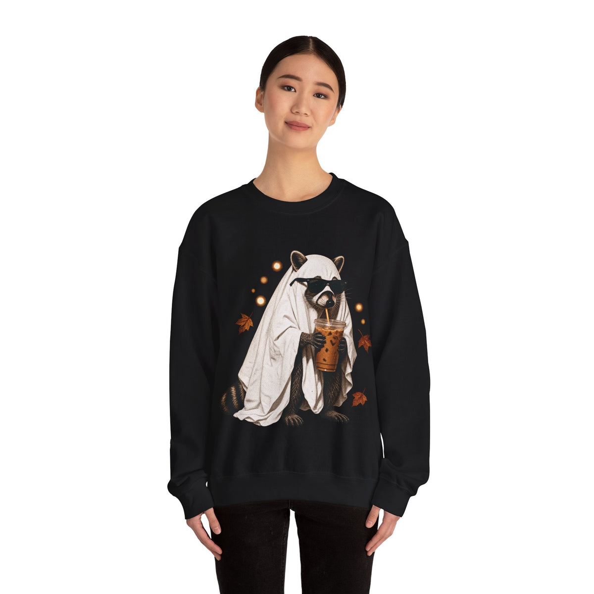 A model wearing a black Wicked Thread Society crewneck sweatshirt featuring a raccoon in a ghost costume with boba.