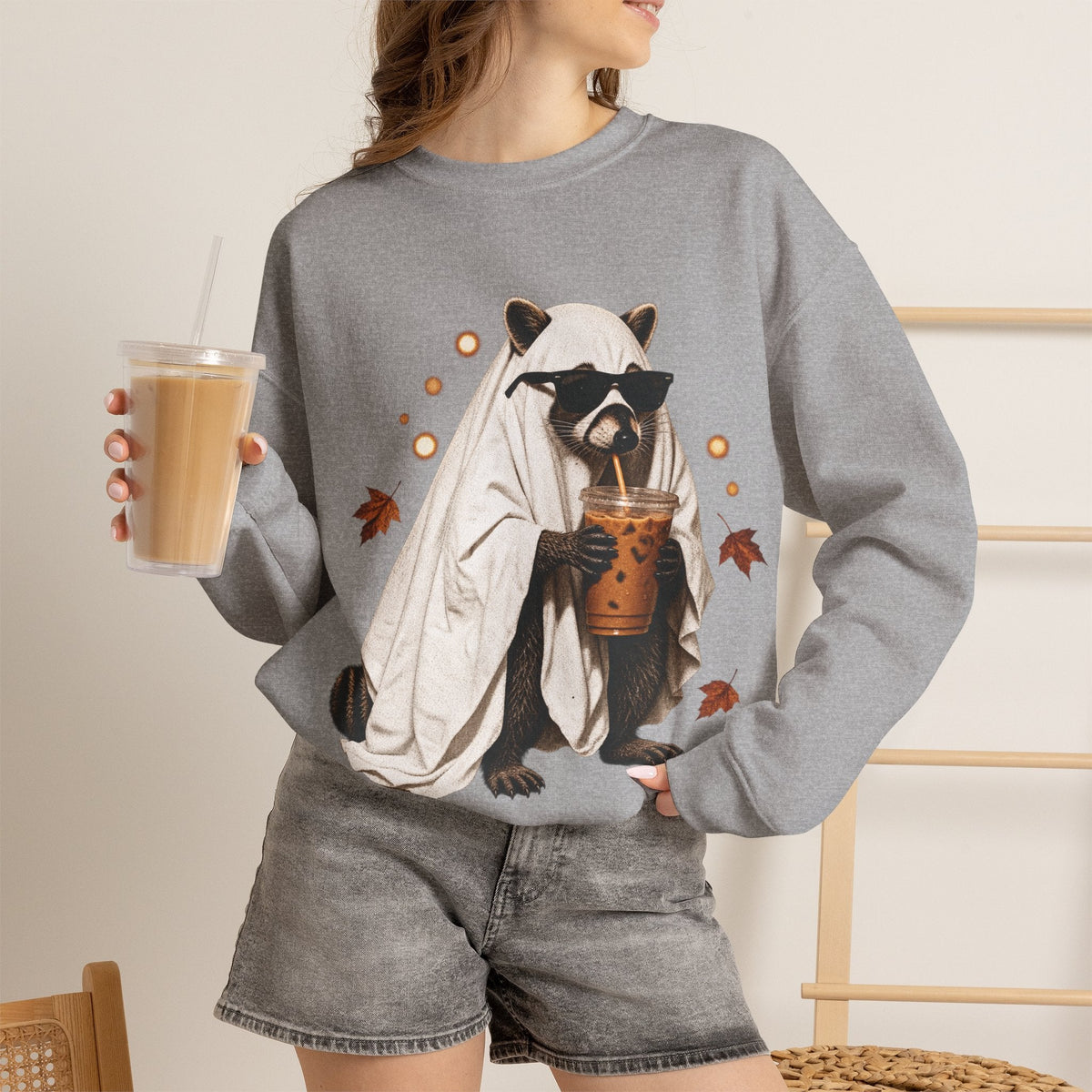 Wicked Thread Society grey crewneck sweatshirt featuring a raccoon in a ghost costume drinking boba tea