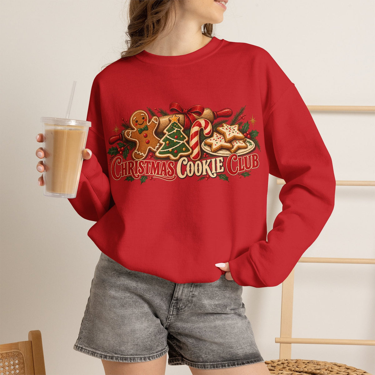 Wicked Thread Society red crewneck sweatshirt featuring a Christmas Cookie Club graphic with gingerbread and candy