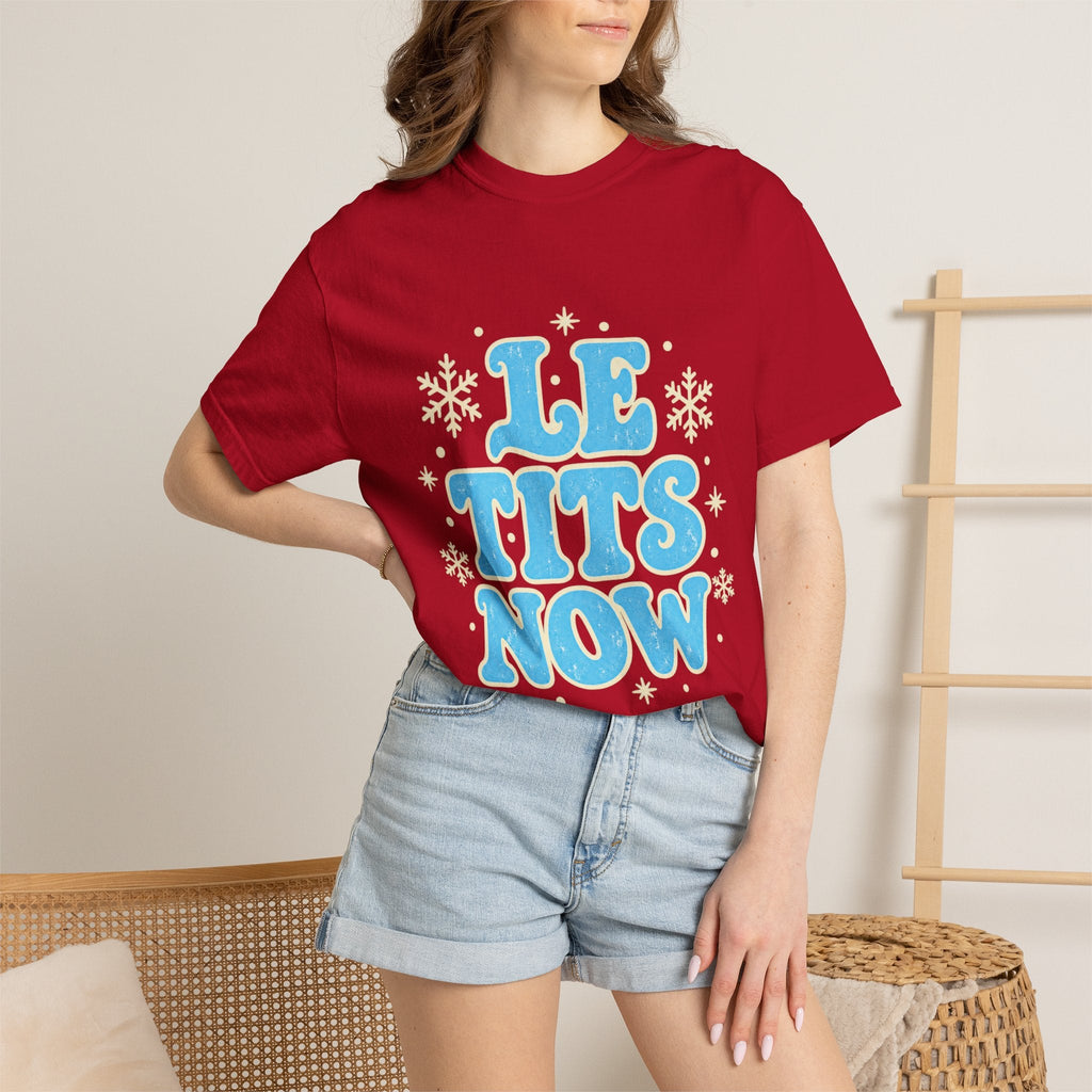 Wicked Thread Society red graphic tee with blue Le Tits Now text and white snowflake accents worn with denim shorts