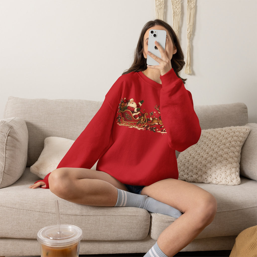 Wicked Thread Society red crewneck sweatshirt with a vintage Santa and reindeer sleigh print worn by a woman on a sofa