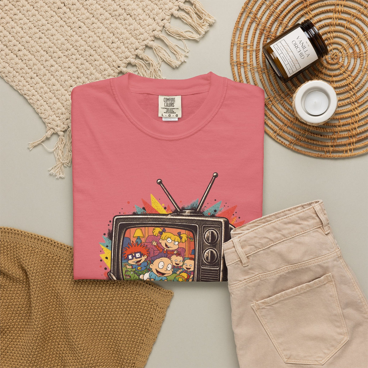 Wicked Thread Society pink graphic t-shirt featuring a retro TV with Rugrats characters on a neutral flat lay.