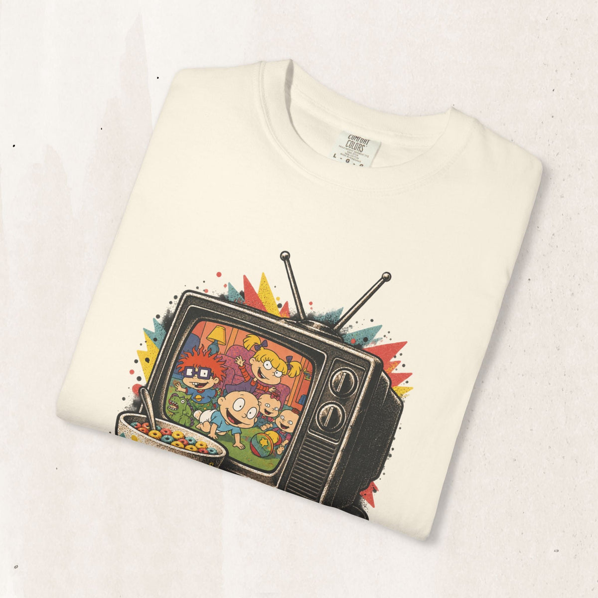 Wicked Thread Society cream graphic t-shirt featuring a retro Rugrats TV design with colorful 90s cartoon characters.