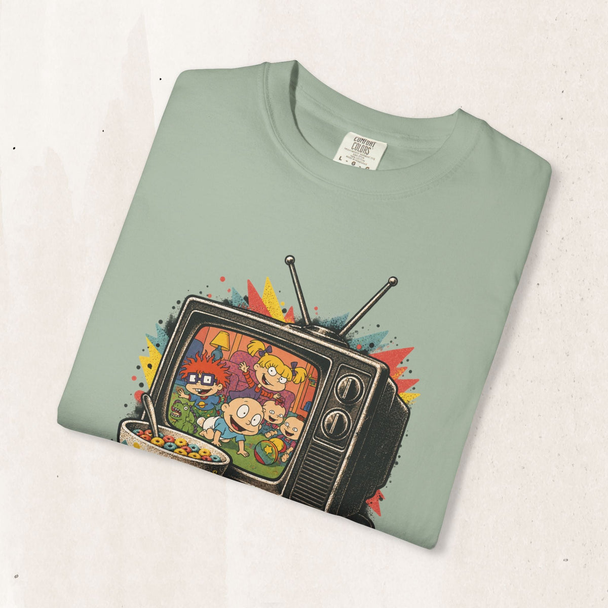 Wicked Thread Society sage green cotton t-shirt featuring a retro Rugrats TV graphic print with 90s cartoon characters