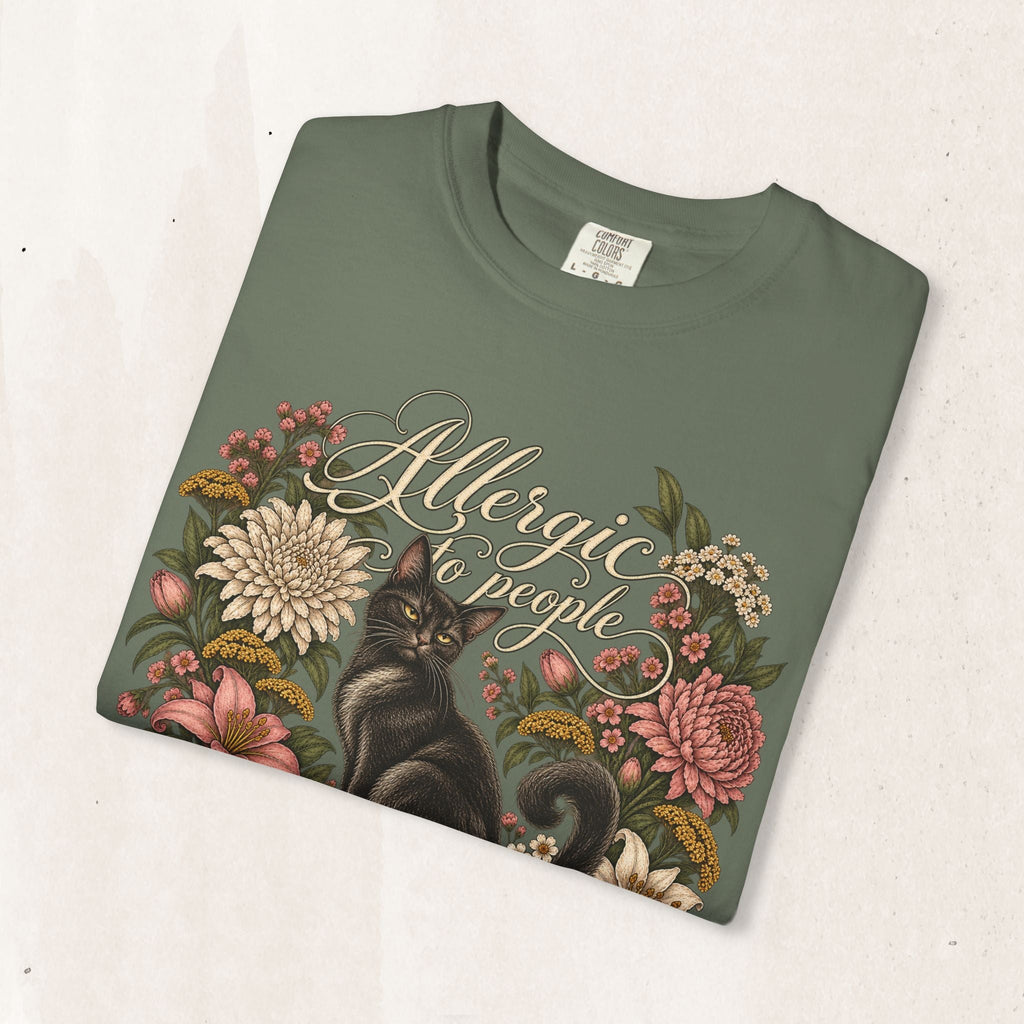 Wicked Thread Society sage green graphic tee featuring a black cat illustration and floral wreath with script text.